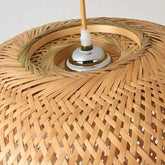 Kuma Bamboo Lamp with intricate woven natural bamboo pattern and metal socket detail at the top center