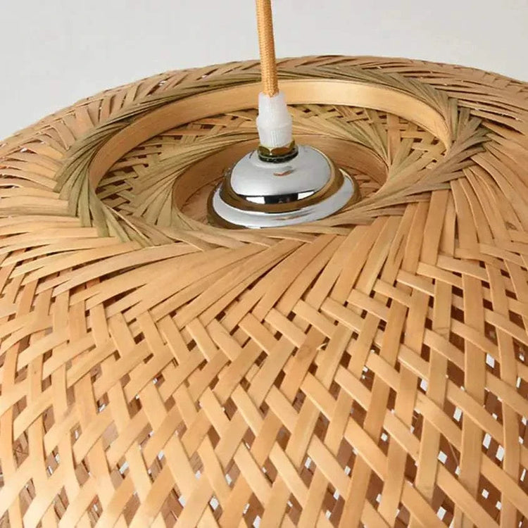 Kuma Bamboo Lamp with intricate woven natural bamboo pattern and metal socket detail at the top center