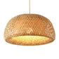 Kuma Bamboo Lamp pendant light with natural woven bamboo shade creating a warm, ambient glow and organic pattern