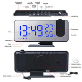 LED Digital Projection Clock with blue LED display, black ABS plastic body, radio, temperature and humidity indicators, projection lens, and multiple function buttons.