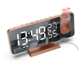 LED Digital Projection Clock with large white LED display, rose gold and black ABS body, shows time, temperature, and humidity.