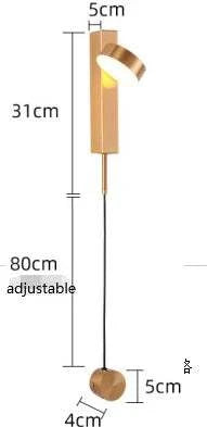 LED indoor Wall Lamps featuring a modern adjustable design in warm metallic finish with a sleek cylindrical shade and thin cord