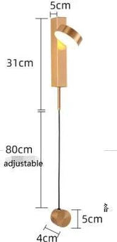 LED indoor Wall Lamps featuring a modern adjustable design in warm metallic finish with a sleek cylindrical shade and thin cord