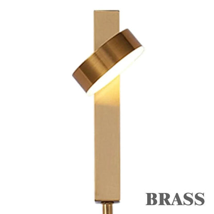 LED indoor Wall Lamps with brass finish, rectangular base, and angled circular light head featuring an acrylic diffuser