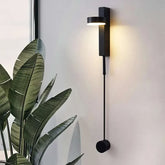 LED indoor Wall Lamps in matte black with a slim rectangular base and round light head, featuring a hanging cord with a circular counterweight