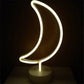 LED Neon Light shaped like a crescent moon with warm white glow on a clear round base