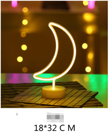 LED Neon Light shaped like a crescent moon with warm yellow glow on a white base, ideal for decorative indoor use