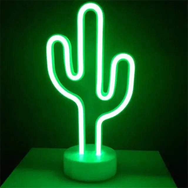 LED Neon Light in the shape of a cactus with bright green glow on a white circular base against a dark background
