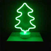 LED Neon Light in bright green shaped like a Christmas tree with a clear round base, battery-operated decorative lamp