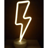 LED Neon Light in the shape of a lightning bolt emitting warm white light on a round white base