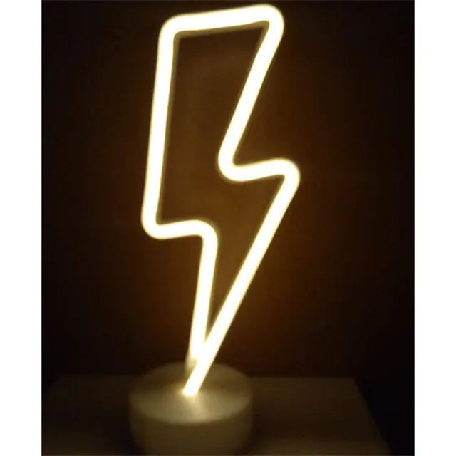 LED Neon Light in the shape of a lightning bolt emitting warm white light on a round white base