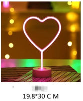 LED Neon Light shaped like a pink glowing heart mounted on a round base, creating a vibrant decorative accent