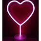 LED Neon Light in bright pink PVC shaped like a heart with a clear round base, glowing vibrantly in the dark