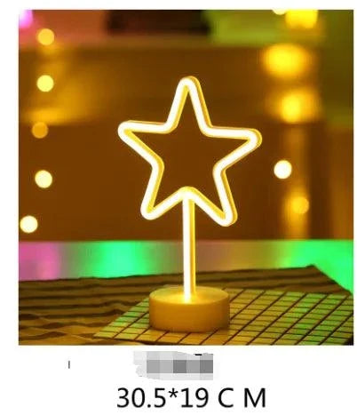 LED Neon Light in the shape of a star glowing warm white on a clear round base with a modern design
