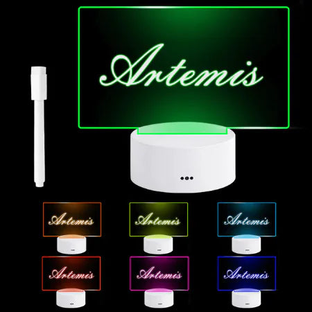 LED Note Board with clear acrylic panel displaying the name Artemis, customizable with multiple glowing colors including green, orange, red, pink, blue, and cyan, accompanied by a white USB-powered base and a white fine-tip marker