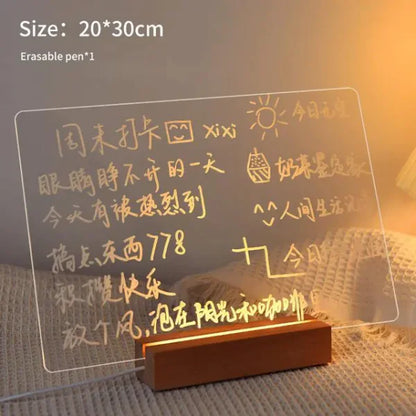 LED Note Board with clear acrylic panel and warm yellow LED lighting, handwritten notes and drawings visible on surface, wooden base stand included