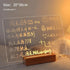 LED Note Board with clear acrylic panel and warm yellow LED lighting, handwritten notes and drawings visible on surface, wooden base stand included