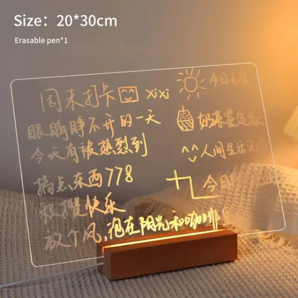 LED Note Board with clear acrylic panel and warm yellow LED lighting, handwritten notes and drawings visible on surface, wooden base stand included