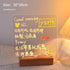 LED Note Board with clear acrylic surface and warm yellow illuminated handwritten messages, resting on a wooden base
