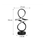 Black modern LED Table Lamp with a double loop design and integrated white LED lighting on a round base