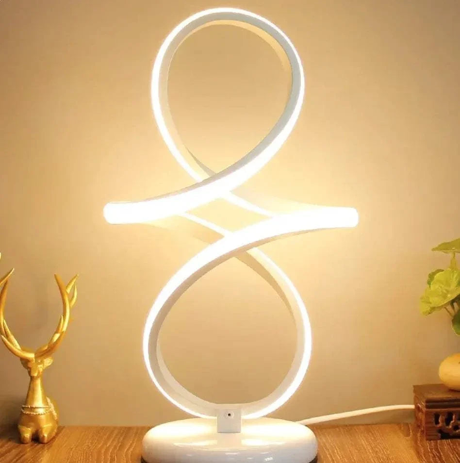 LED Table Lamp with white flexible LED strip in a modern loop design on a white base, emitting bright ambient light