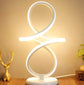 LED Table Lamp with white flexible LED strip in a modern loop design on a white base, emitting bright ambient light