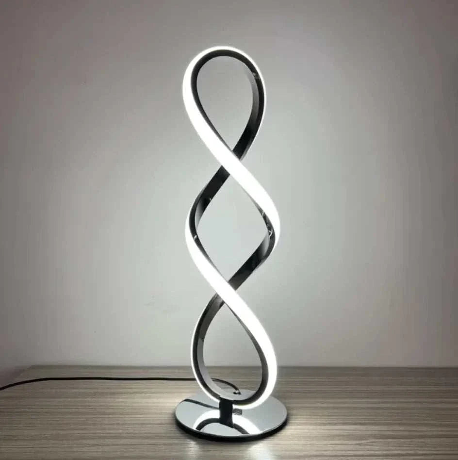 LED Table Lamp with modern silver electroplated design, featuring a sleek infinity loop shape and bright ambient light