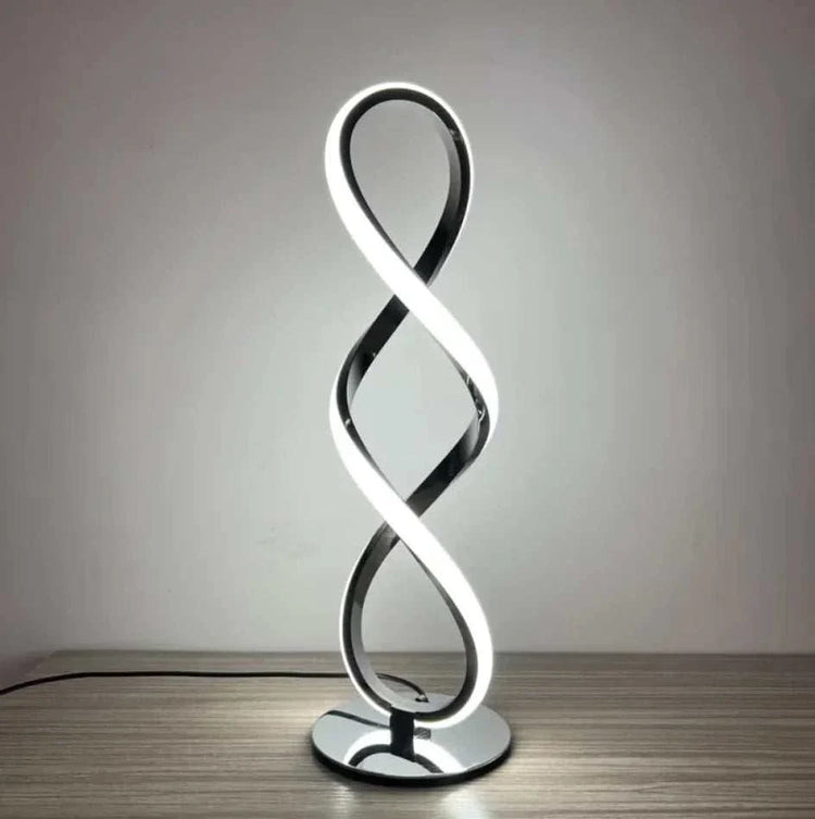 LED Table Lamp with modern silver electroplated design, featuring a sleek infinity loop shape and bright ambient light