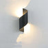 LED Waterproof Outdoor Wall Lamp in black metal with a modern curved design illuminating light upwards and downwards