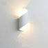LED Waterproof Outdoor Wall Lamp with sleek white curved metal body illuminating up and down with warm light