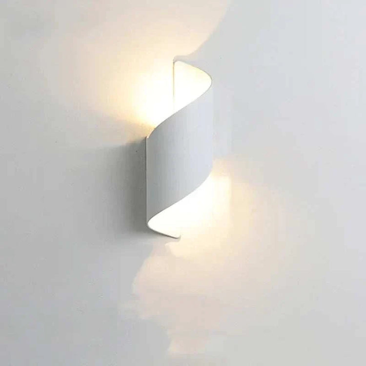 LED Waterproof Outdoor Wall Lamp in white metal with a modern curved design casting soft upward and downward light