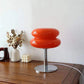 Macaron LED Lamp with glossy red double-disc shade, chrome stem and round metal base
