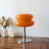 Macaron LED Lamp with glossy orange double-disk shade, chrome stem and round metallic base