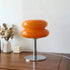 Macaron LED Lamp with glossy orange double-disk shade, chrome stem and round metallic base