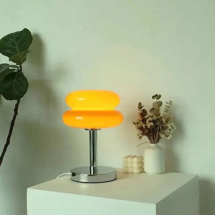 Macaron LED Lamp with two stacked orange rounded shades, a chrome stem and circular metal base