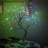 Mini Christmas Tree with flexible dark branches adorned with multicolor LED lights creating a festive glowing decoration