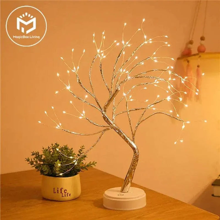 Mini Christmas Tree LED lamp with silver copper wire branches and warm white LED lights on a white round base