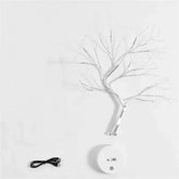 Mini Christmas Tree LED lamp with silver copper wire branches, warm white lights, round white base, and black USB cable