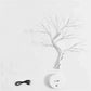 Mini Christmas Tree LED lamp with silver copper wire branches, warm white lights, round white base, and black USB cable