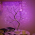 Mini Christmas Tree LED lamp with silver flexible wire branches illuminated by warm white LED lights in a compact indoor decorative design