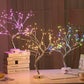 Mini Christmas Tree LED lamp with flexible silver wire branches illuminated by multicolored warm LED lights for festive decor