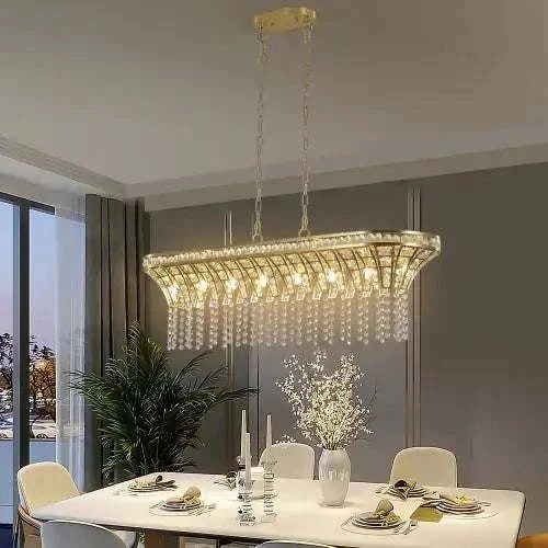Modern Champagne Gold Kitchen Island Lamp with oval crystal chandelier design, champagne gold metal frame, and hanging clear crystal beads