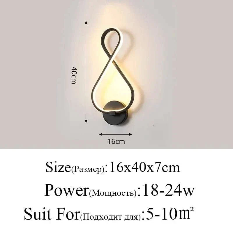 Modern Wall Lamps with black aluminum body, looped design, and acrylic light diffuser, emitting warm illumination.