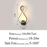 Modern Wall Lamps with black aluminum body and acrylic light, looped figure-eight design, warm up-down illumination