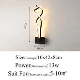 Modern Wall Lamps featuring a black aluminum base and twisting LED acrylic light strips with warm white illumination.
