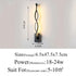 Modern Wall Lamps featuring a sleek black aluminum body with twisting design and warm LED illumination, 47.5 cm tall.