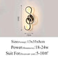 Modern Wall Lamps featuring a black metal frame shaped like a treble clef with integrated warm LED lighting and sleek minimalist design.