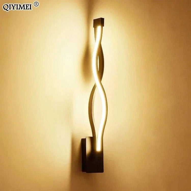 Modern Wall Lamps featuring a black aluminum body with a twisted acrylic light strip creating warm up-down illumination.