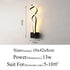 Modern Wall Lamps with black aluminum base, curved acrylic light strips, and warm LED illumination in a sleek, contemporary design.