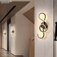 Modern Wall Lamps featuring black aluminum bodies with illuminated treble clef design and warm white LED lighting for stylish decor.